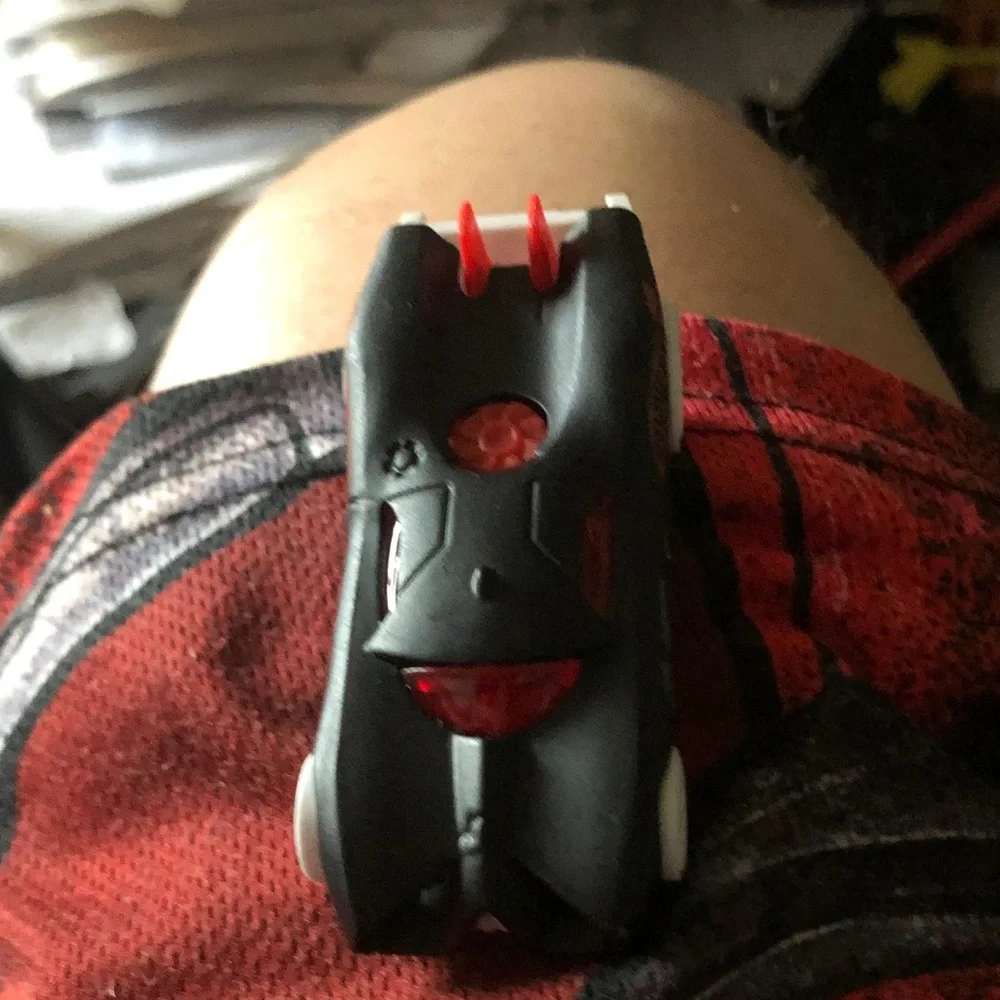 Black and Red Toy Car with White Wheels